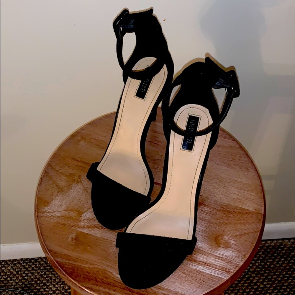 Black open-toe heels w/ strap around the ankle